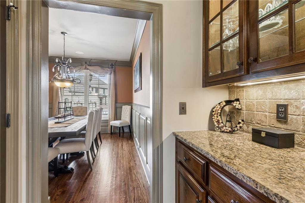 2391 Hopehaven Way Hoschton, GA 30548 - Photo 18 of 87 a kitchen with granite countertop lots of counter top space and wooden floor