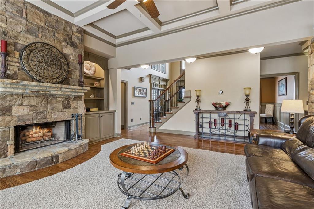 2391 Hopehaven Way Hoschton, GA 30548 - Photo 26 of 87 a living room with furniture and a fireplace