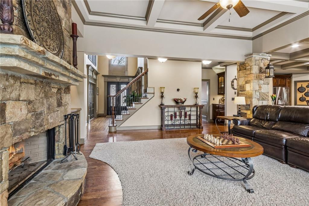 2391 Hopehaven Way Hoschton, GA 30548 - Photo 27 of 87 a living room with patio furniture and a fireplace