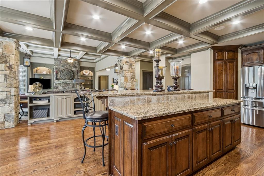 2391 Hopehaven Way Hoschton, GA 30548 - Photo 29 of 87 a kitchen with stainless steel appliances granite countertop a sink and cabinets