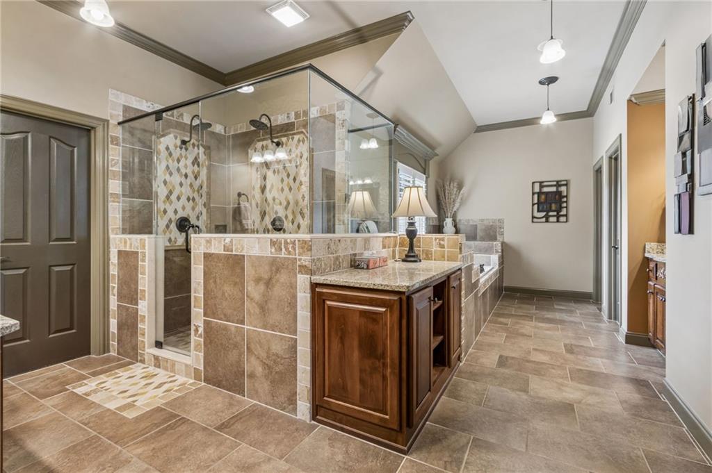 2391 Hopehaven Way Hoschton, GA 30548 - Photo 38 of 87 a bathroom with a sink a toilet and shower