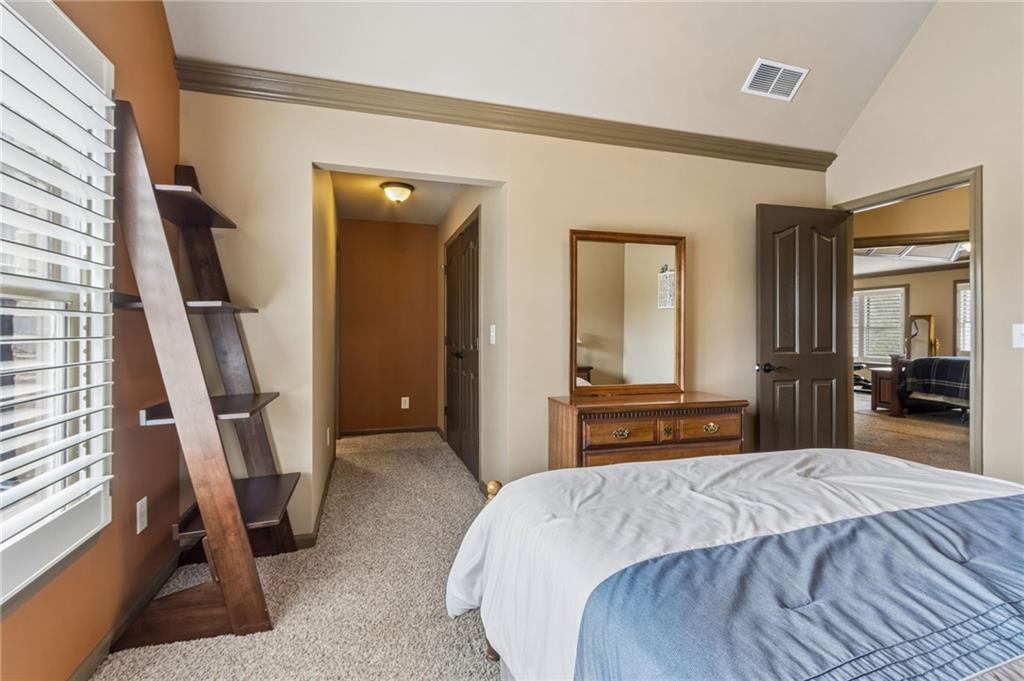 2391 Hopehaven Way Hoschton, GA 30548 - Photo 45 of 87 a bedroom with a bed and a large mirror on the dresser