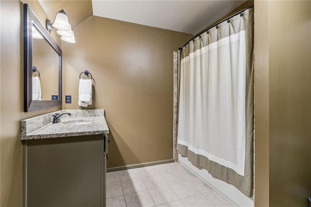 2391 Hopehaven Way Hoschton, GA 30548 - Photo 46 of 87 a bathroom with a granite countertop sink and a mirror