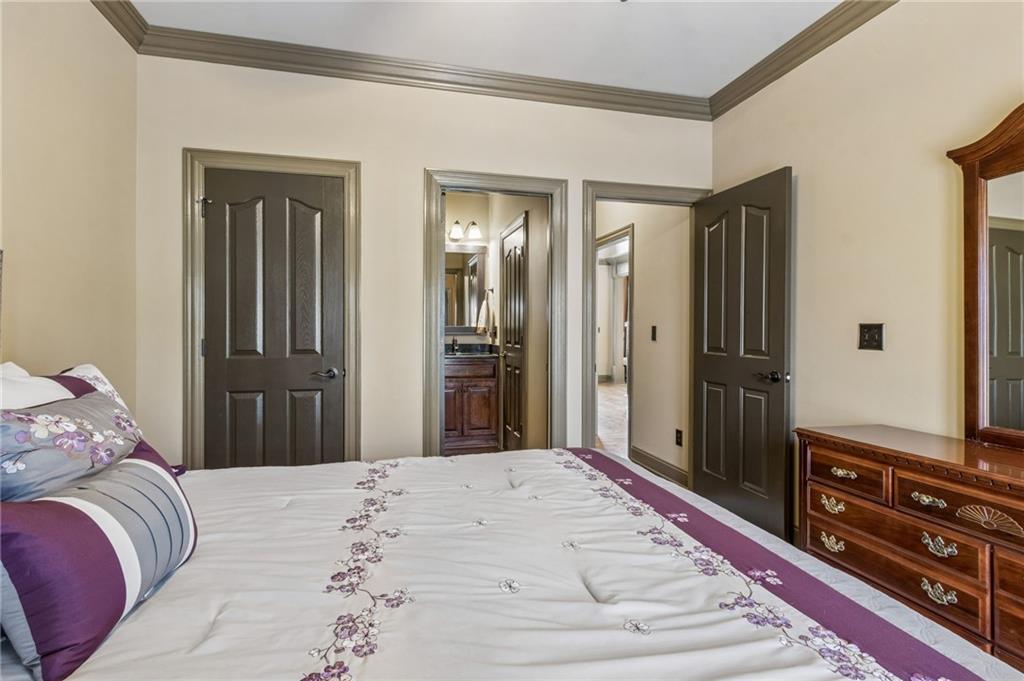 2391 Hopehaven Way Hoschton, GA 30548 - Photo 57 of 87 a bedroom with a bed and a dresser