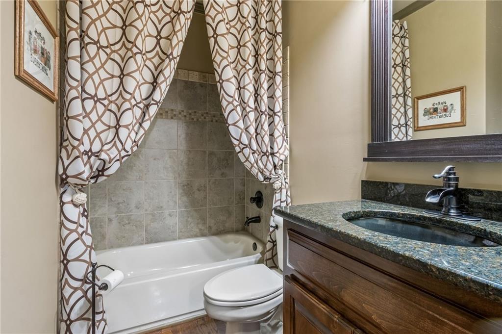 2391 Hopehaven Way Hoschton, GA 30548 - Photo 58 of 87 a bathroom with a granite countertop sink toilet and bathtub