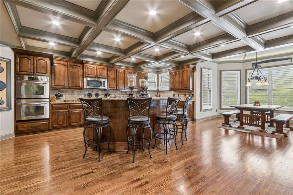 2391 Hopehaven Way Hoschton, GA 30548 - Photo 6 of 87 a view of a dining room with furniture window and wooden floor