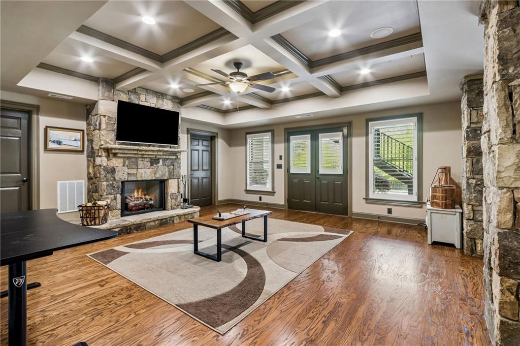 2391 Hopehaven Way Hoschton, GA 30548 - Photo 62 of 87 a living room with furniture fireplace and flat screen tv