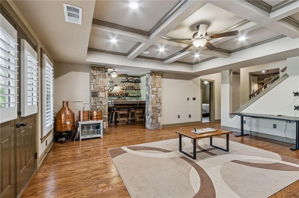 2391 Hopehaven Way Hoschton, GA 30548 - Photo 64 of 87 a outdoor space with lots of furniture and chandelier