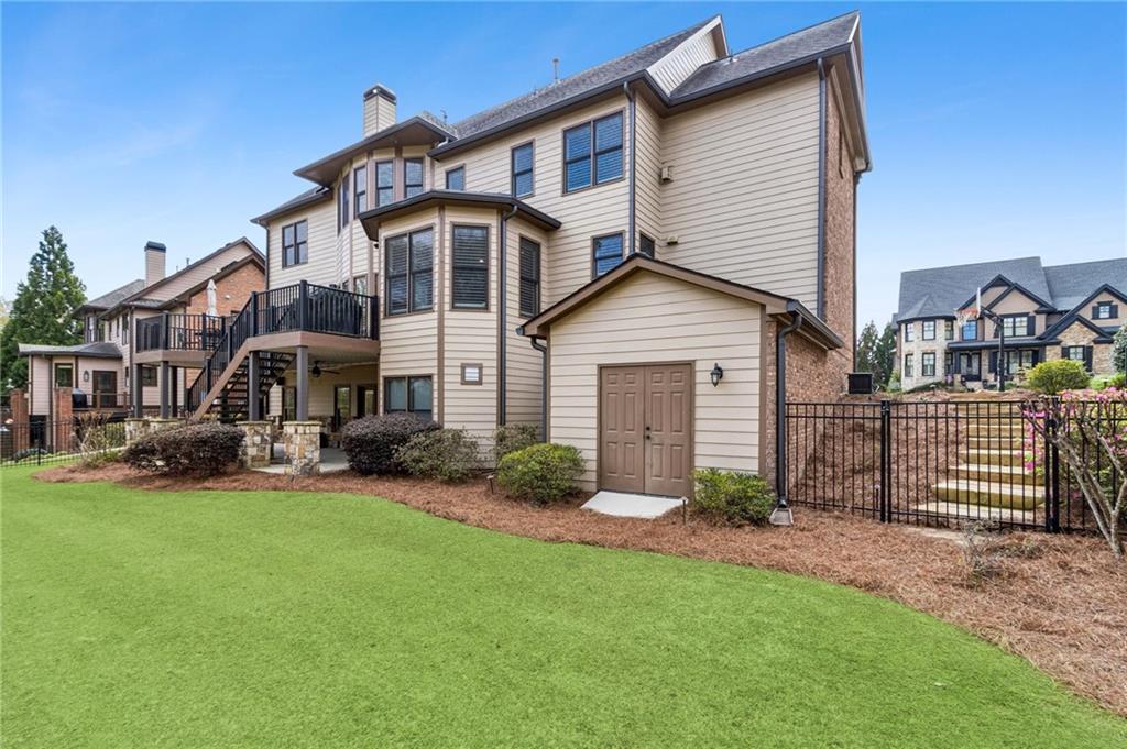 2391 Hopehaven Way Hoschton, GA 30548 - Photo 75 of 87 a view of a house with a yard and sitting area