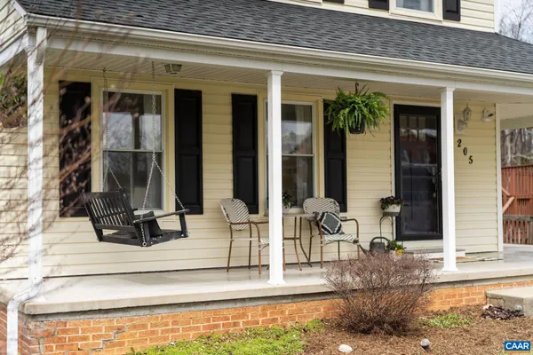a kitchen with cabinets a sink and white appliances