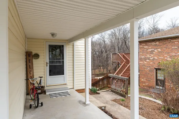 a kitchen with stainless steel appliances stove refrigerator and wooden floor