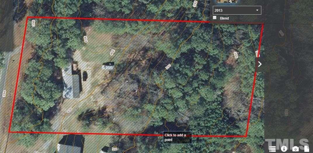 3041 Holland Road Apex, NC 27502 - Photo 2 of 7 Property adjoins Catholic Church on left side