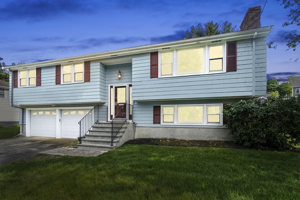 18 Julia Road Needham, MA 02492 - Photo 1 of 41 a front view of a house with a garden and yard