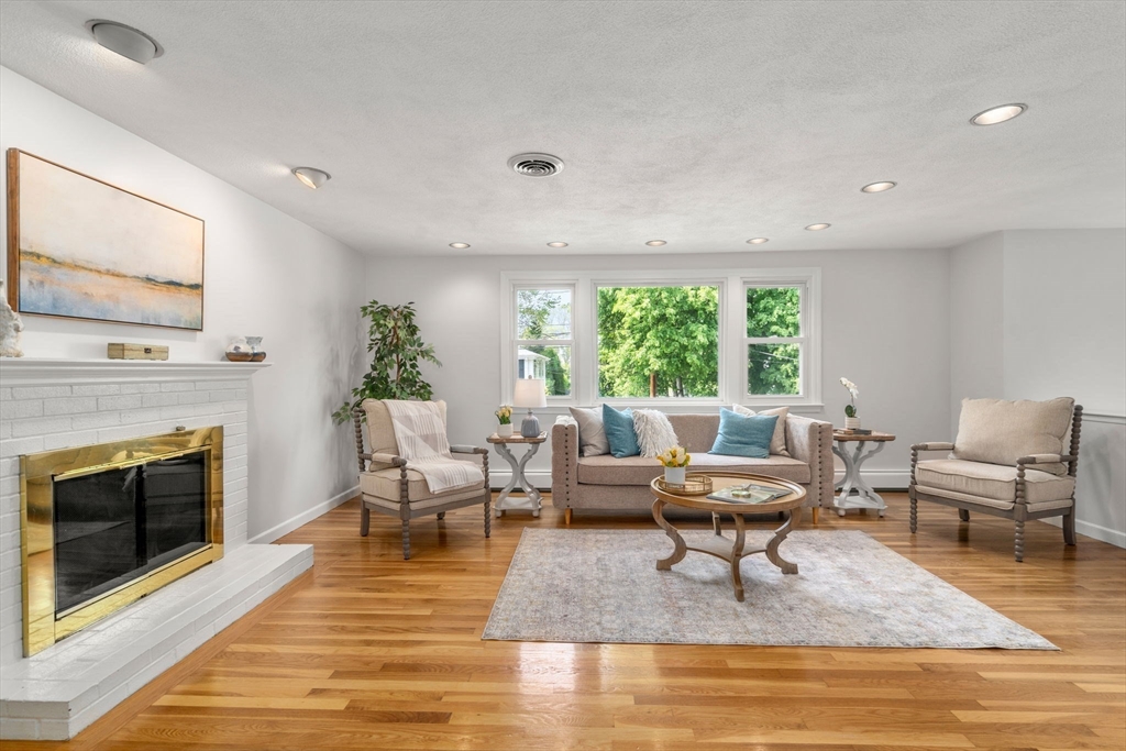 18 Julia Road Needham, MA 02492 - Photo 11 of 41 a living room with furniture and a fireplace