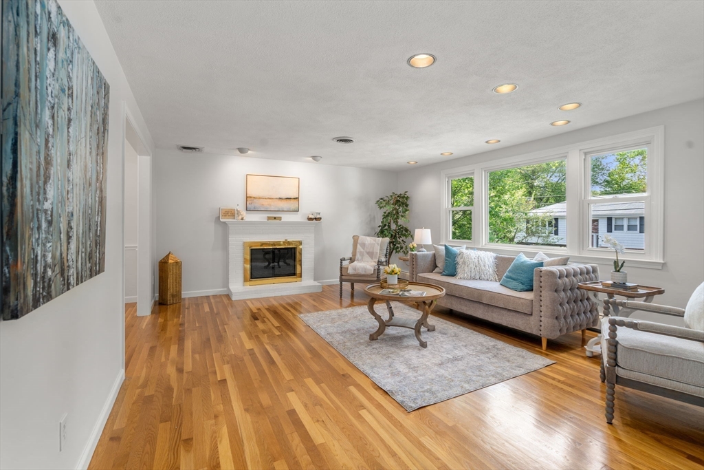 18 Julia Road Needham, MA 02492 - Photo 12 of 41 a living room with furniture and a fireplace