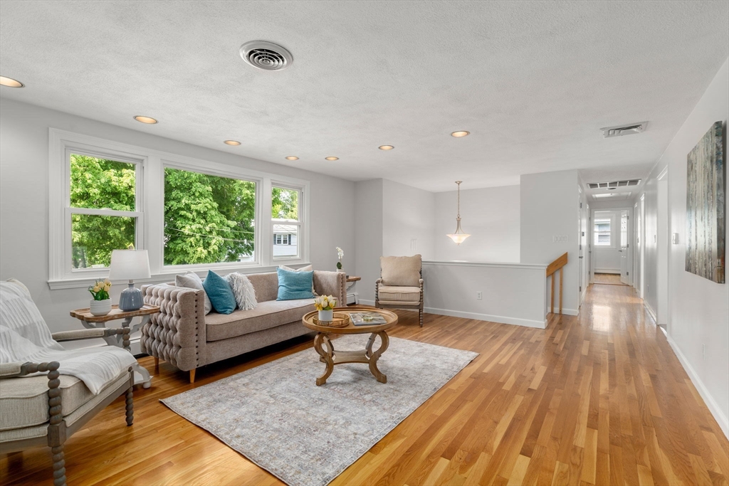 18 Julia Road Needham, MA 02492 - Photo 14 of 41 a living room with furniture and a rug