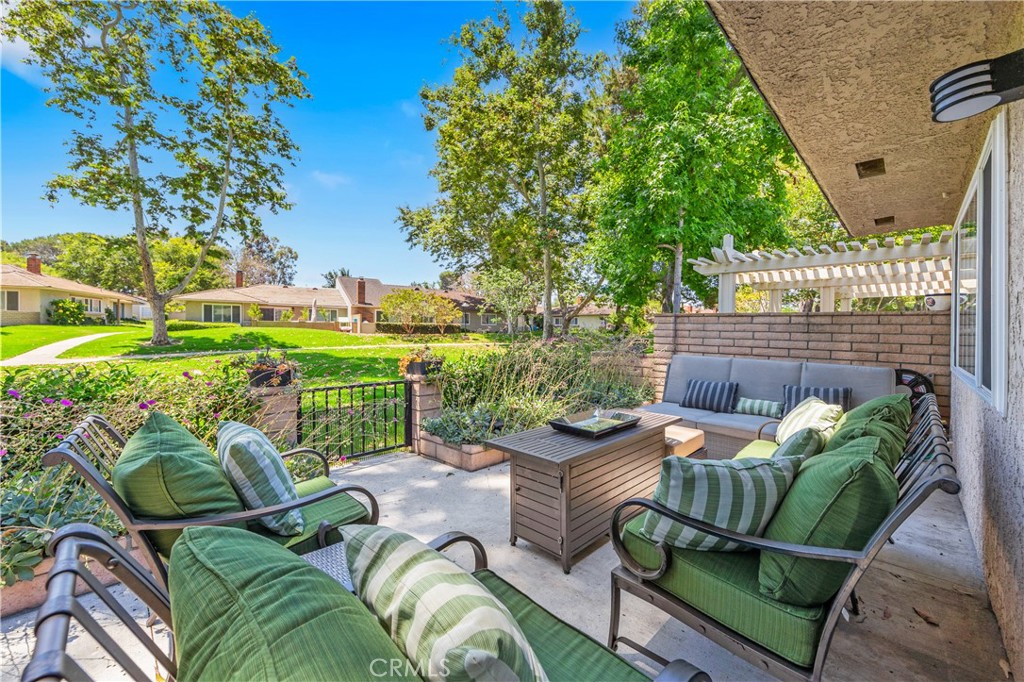 a view of a chair and table in backyard