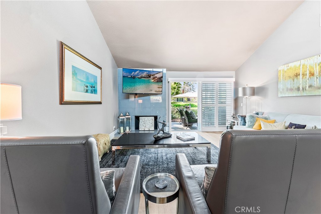17294 Citron Irvine, CA 92612 - Photo 13 of 26 a dining room with furniture a large window and wooden floor