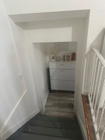 a kitchen with a sink appliances and cabinets