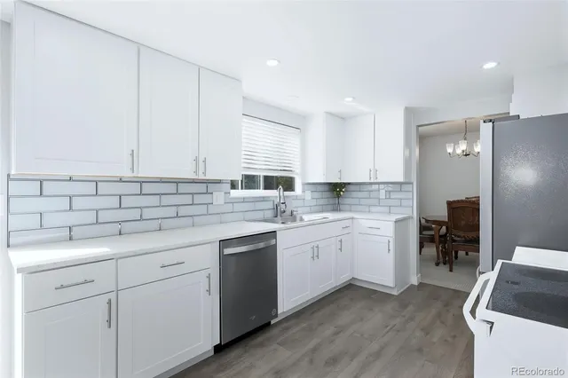 a kitchen with sink cabinets and stove