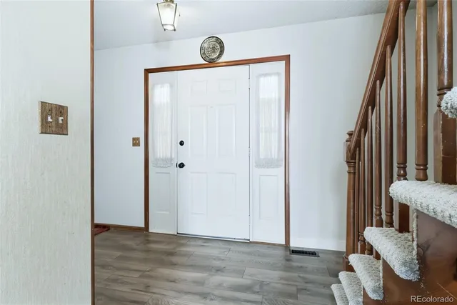 a view of livingroom with furniture and wooden floor