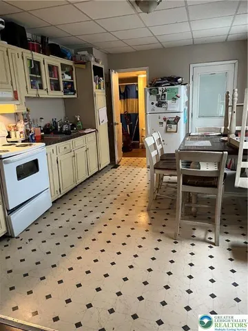 a kitchen with granite countertop a sink and cabinets