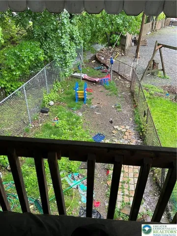 a view of swimming pool from a balcony