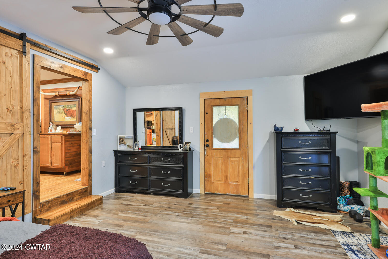 433 Jolly Springs Road Dresden, TN 38225 - Photo 13 of 64 a room with a dresser and a television