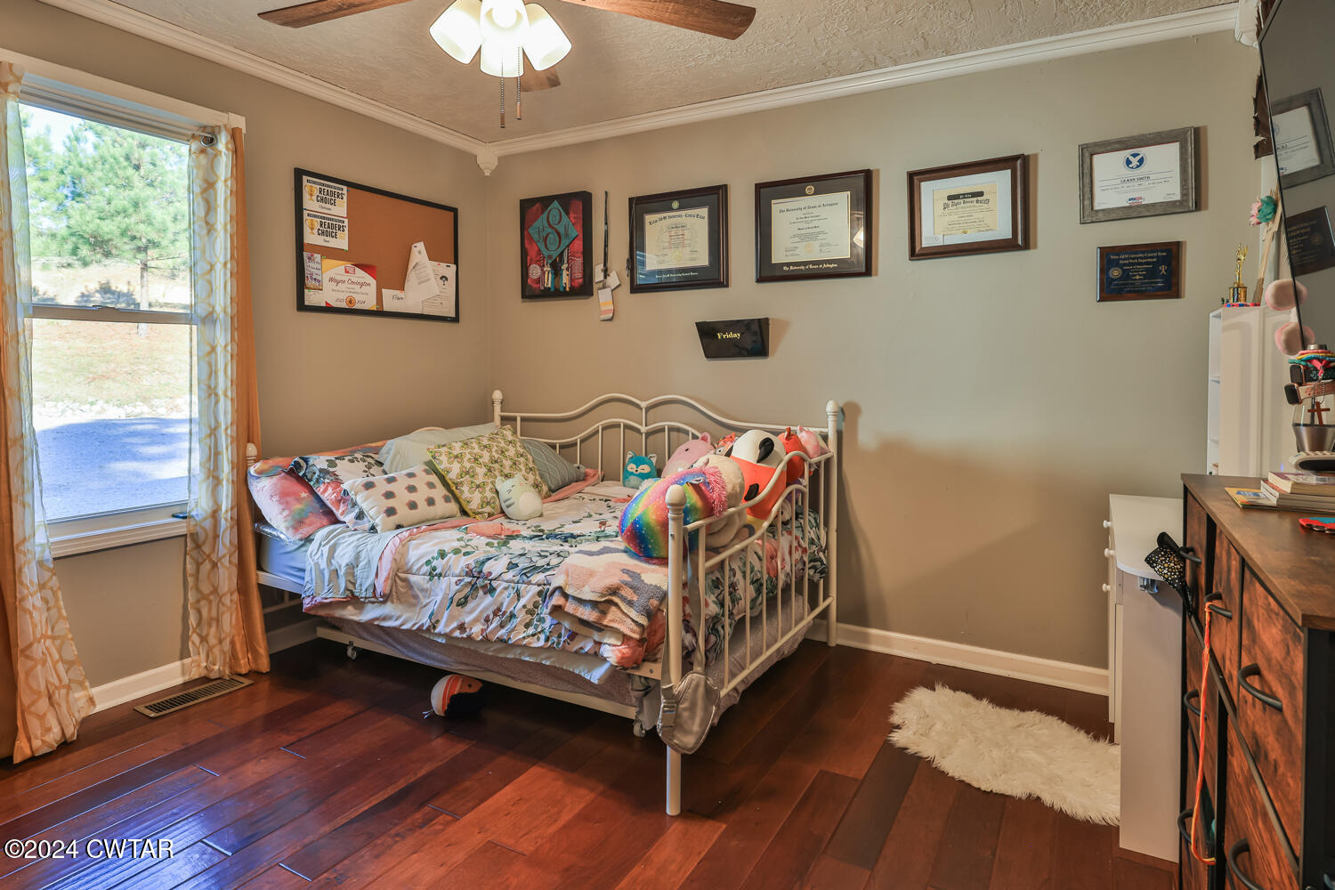 433 Jolly Springs Road Dresden, TN 38225 - Photo 17 of 64 a bedroom with a bed and a chandelier