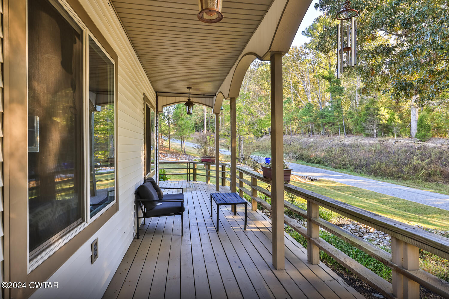 433 Jolly Springs Road Dresden, TN 38225 - Photo 44 of 64 a view of a balcony with chairs and wooden floor
