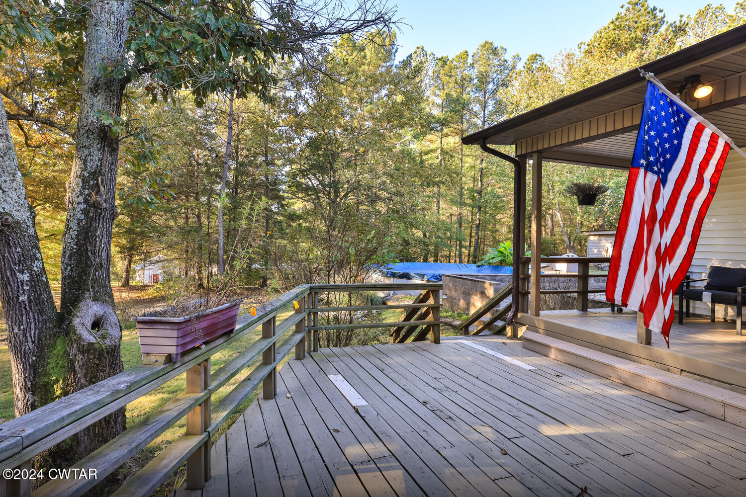 433 Jolly Springs Road Dresden, TN 38225 - Photo 46 of 64 a view of a deck with chairs and wooden floor