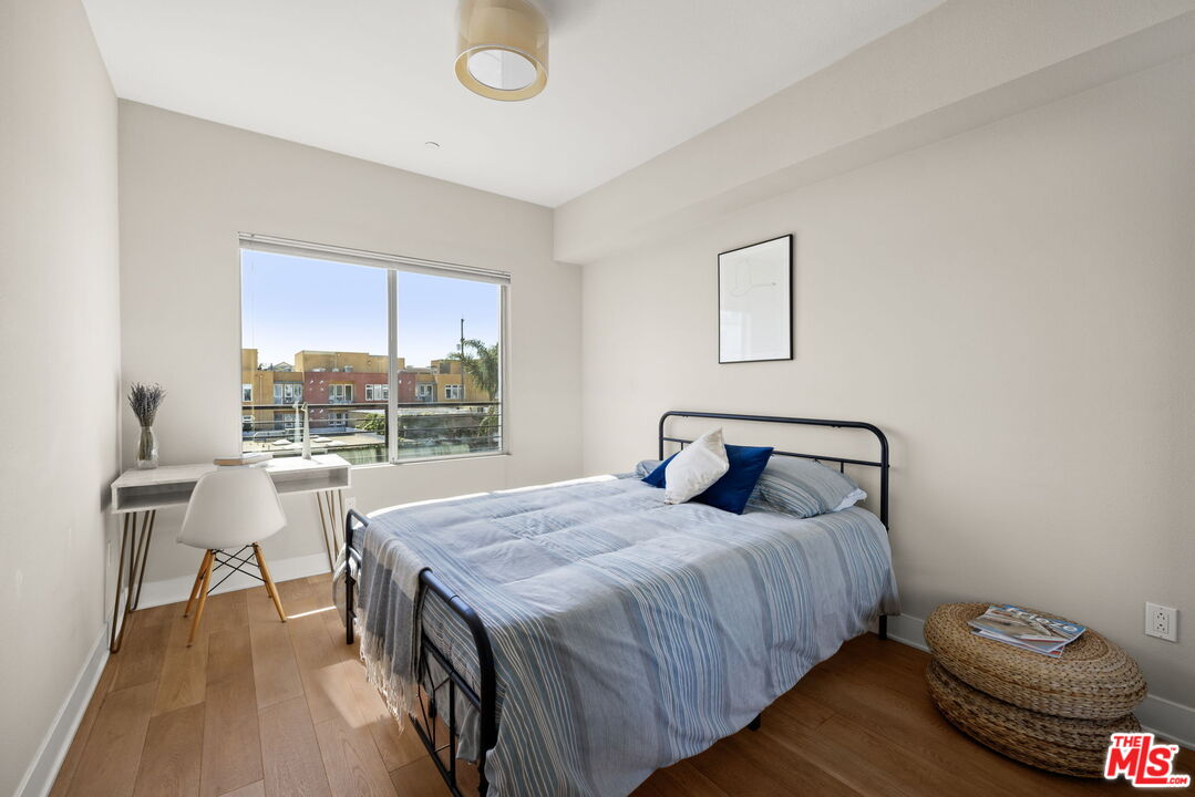 13337 Beach Avenue, Unit 406 Marina del Rey, CA 90292 - Photo 13 of 23 a bedroom with a bed and a window