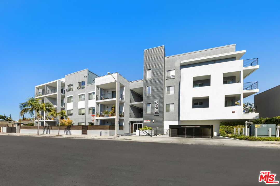 13337 Beach Avenue, Unit 406 Marina del Rey, CA 90292 - Photo 2 of 23 a front view of a building with street view