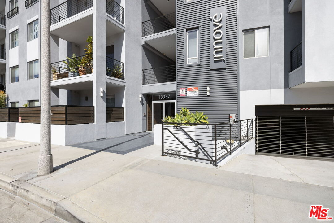 13337 Beach Avenue, Unit 406 Marina del Rey, CA 90292 - Photo 3 of 23 a view of a house with glass door and a window