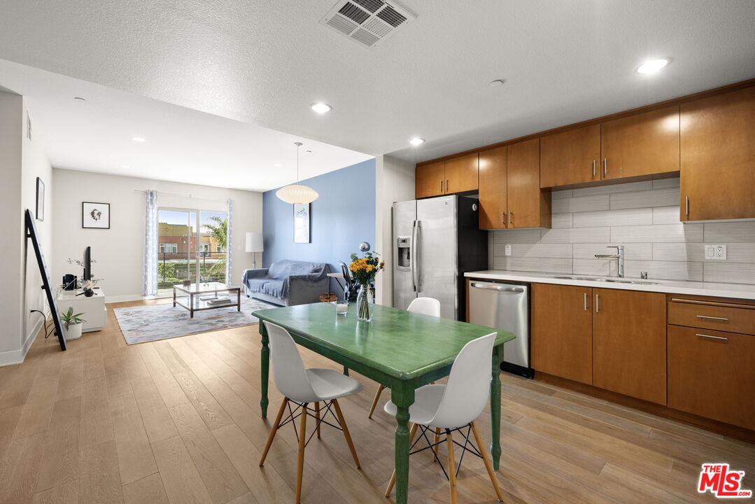 13337 Beach Avenue, Unit 406 Marina del Rey, CA 90292 - Photo 7 of 23 a kitchen with sink table and chairs