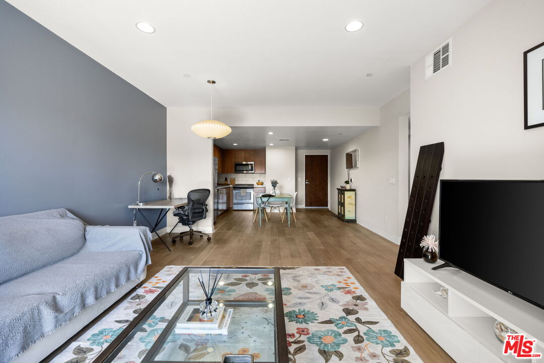 13337 Beach Avenue, Unit 406 Marina del Rey, CA 90292 - Photo 9 of 23 a living room with furniture and a flat screen tv