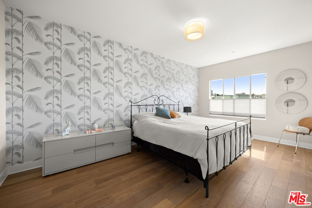 13337 Beach Avenue, Unit 406 Marina del Rey, CA 90292 - Photo 10 of 23 a bedroom with a bed and a window
