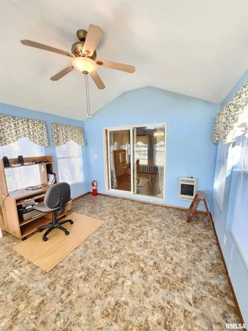 an empty room with a empty space and windows