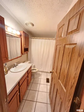 a kitchen that has a sink and a stove in it