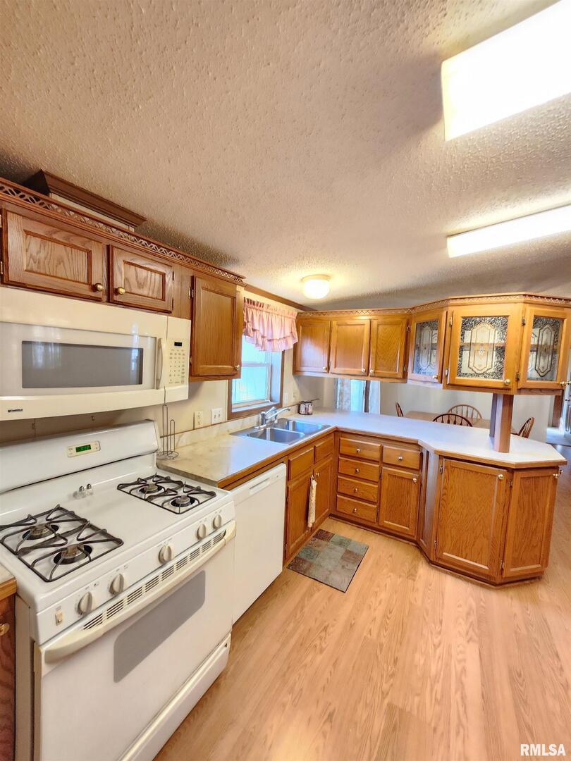 37 Janet Lane Murphysboro, IL 62966 - Photo 19 of 32 a kitchen with stainless steel appliances granite countertop a stove and a sink