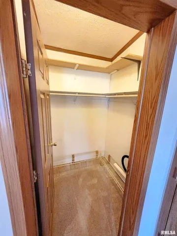 a bathroom with a sink and mirror with bathtub