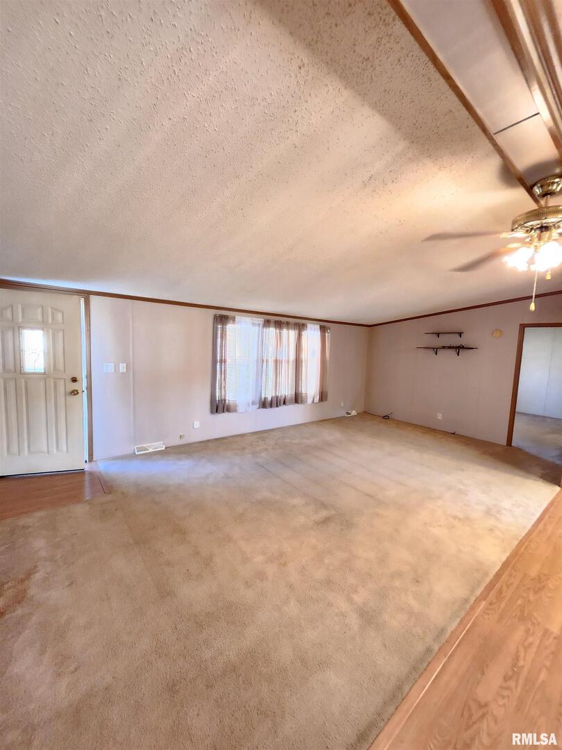 37 Janet Lane Murphysboro, IL 62966 - Photo 8 of 32 an empty room with wooden cabinet and windows