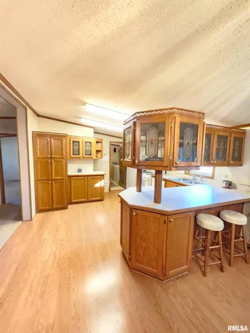 a view of a house with pool and chairs