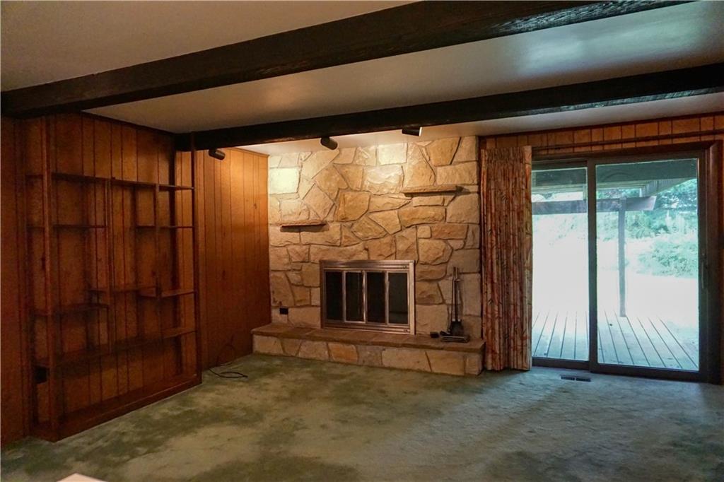 142 Wise Road Butler, PA 16002 - Photo 23 of 36 a view of an empty room with a fireplace and a window