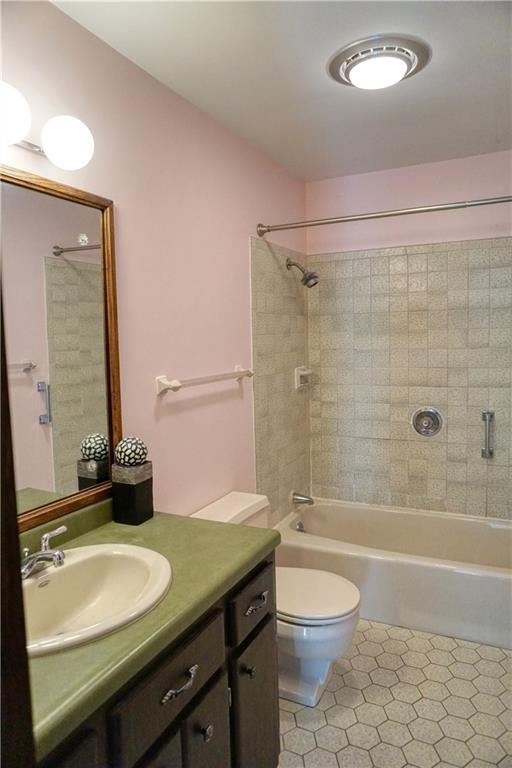 142 Wise Road Butler, PA 16002 - Photo 27 of 36 a bathroom with a granite countertop sink toilet a mirror and shower