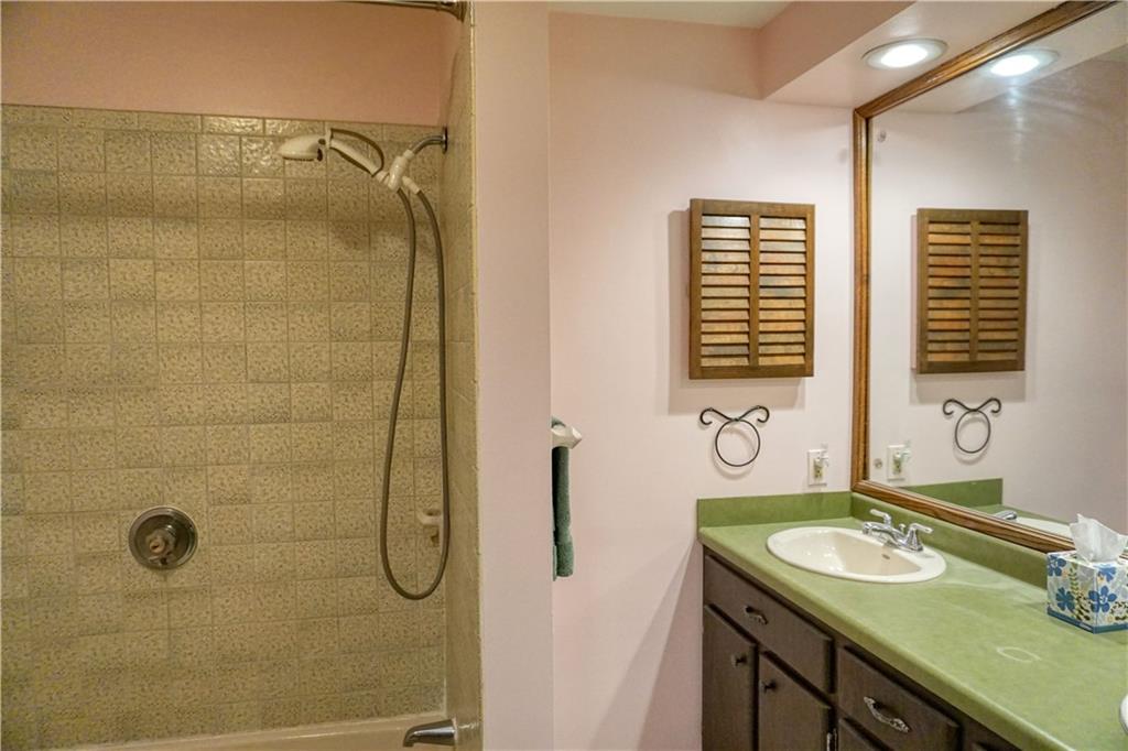 142 Wise Road Butler, PA 16002 - Photo 33 of 36 a bathroom with a granite countertop sink and a shower