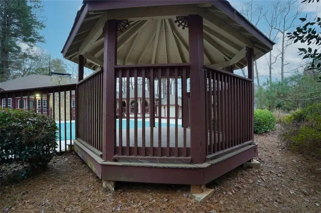 a view of a backyard with a small deck and deck
