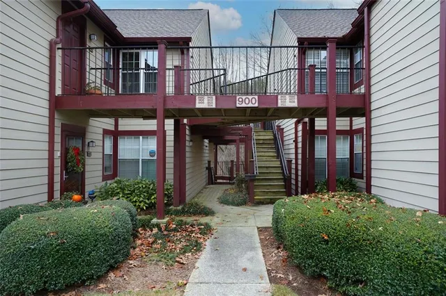 a balcony with furniture and wooden floor