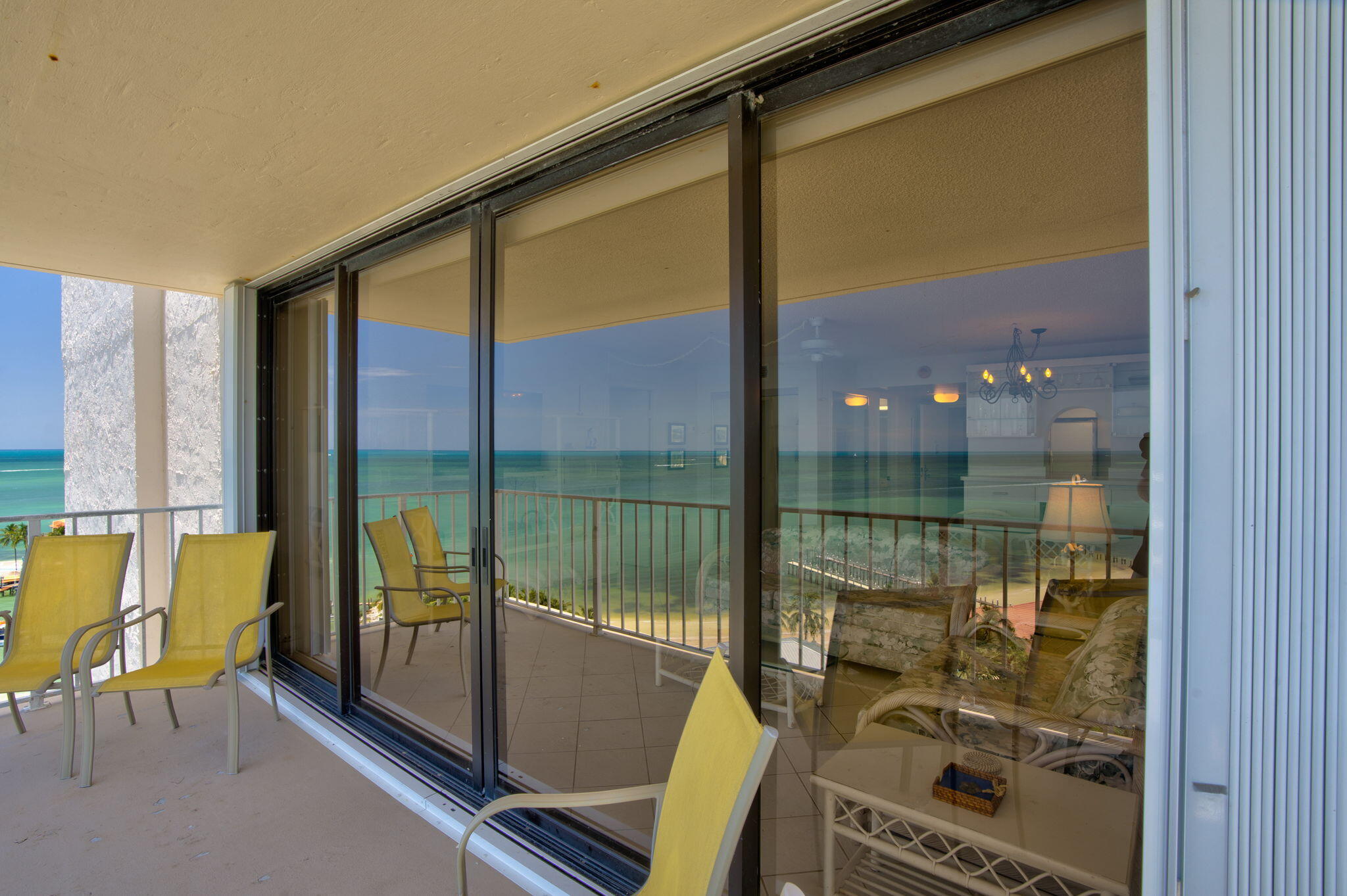 2000 Coco Plum Drive, Unit 1202 Marathon, FL 33050 - Photo 18 of 44 a bathroom with a glass door