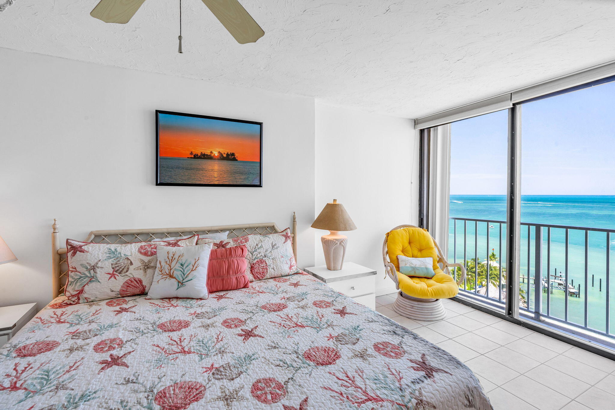 2000 Coco Plum Drive, Unit 1202 Marathon, FL 33050 - Photo 19 of 44 a bedroom with a bed and wooden floor